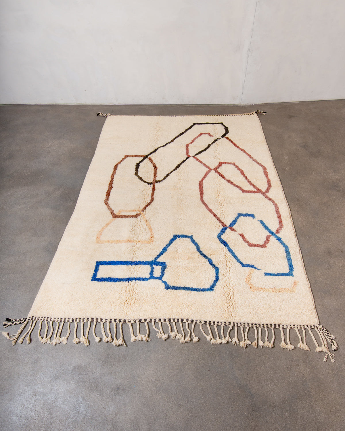 Modern, designer, handcrafted Berber rug from Morocco. Beniourain carpet with beautiful colours and patterns and fluffy wool texture.